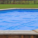 Bâche solaire GRE 400µm pour piscine rectangulaire en bois véritable menthe